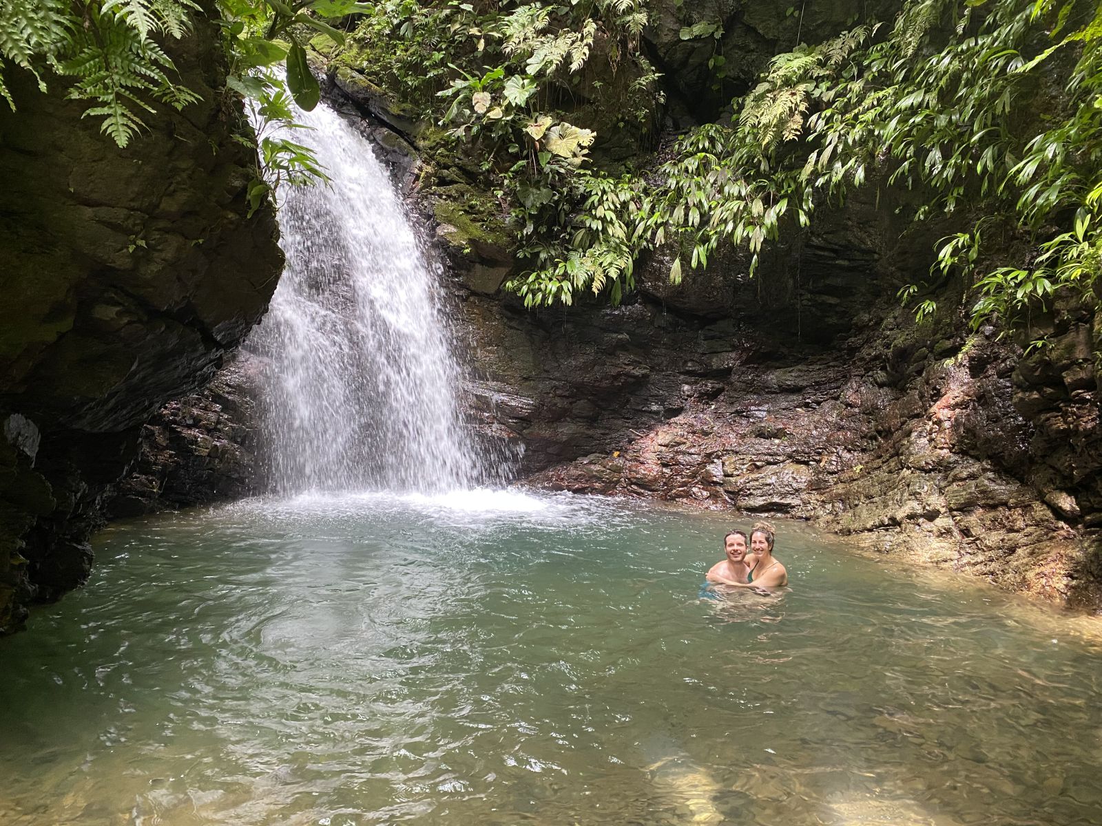 Couple in a Waterfall pool, Hacienda Ébano, a Nature Reserve and Farm with Rainforest and Waterfalls at Barú, Costa Rica